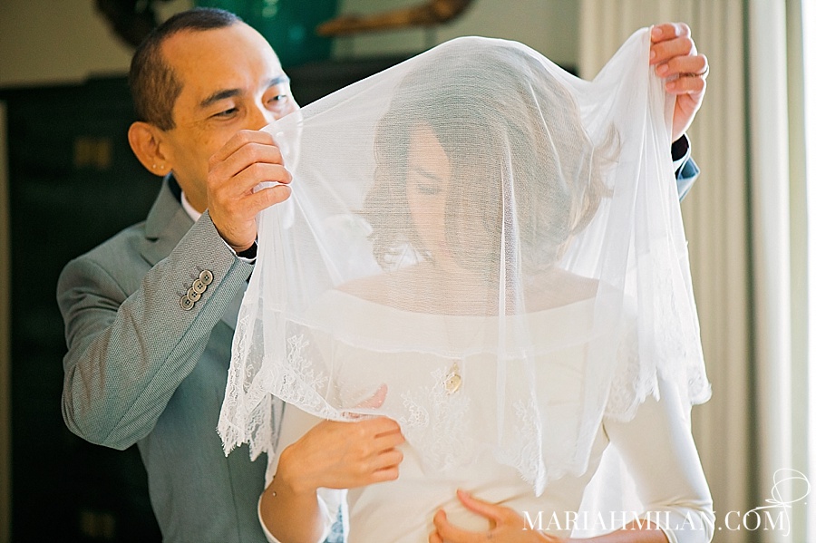 Father putting on Veil