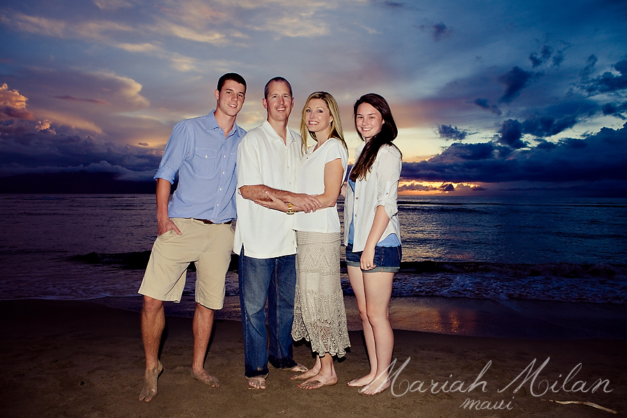 Family poses for sunset picture at Baby Beach Maui