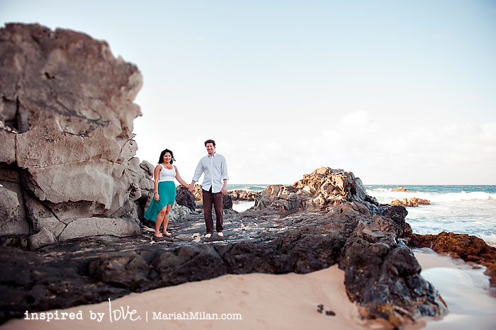 couple on beach rocks