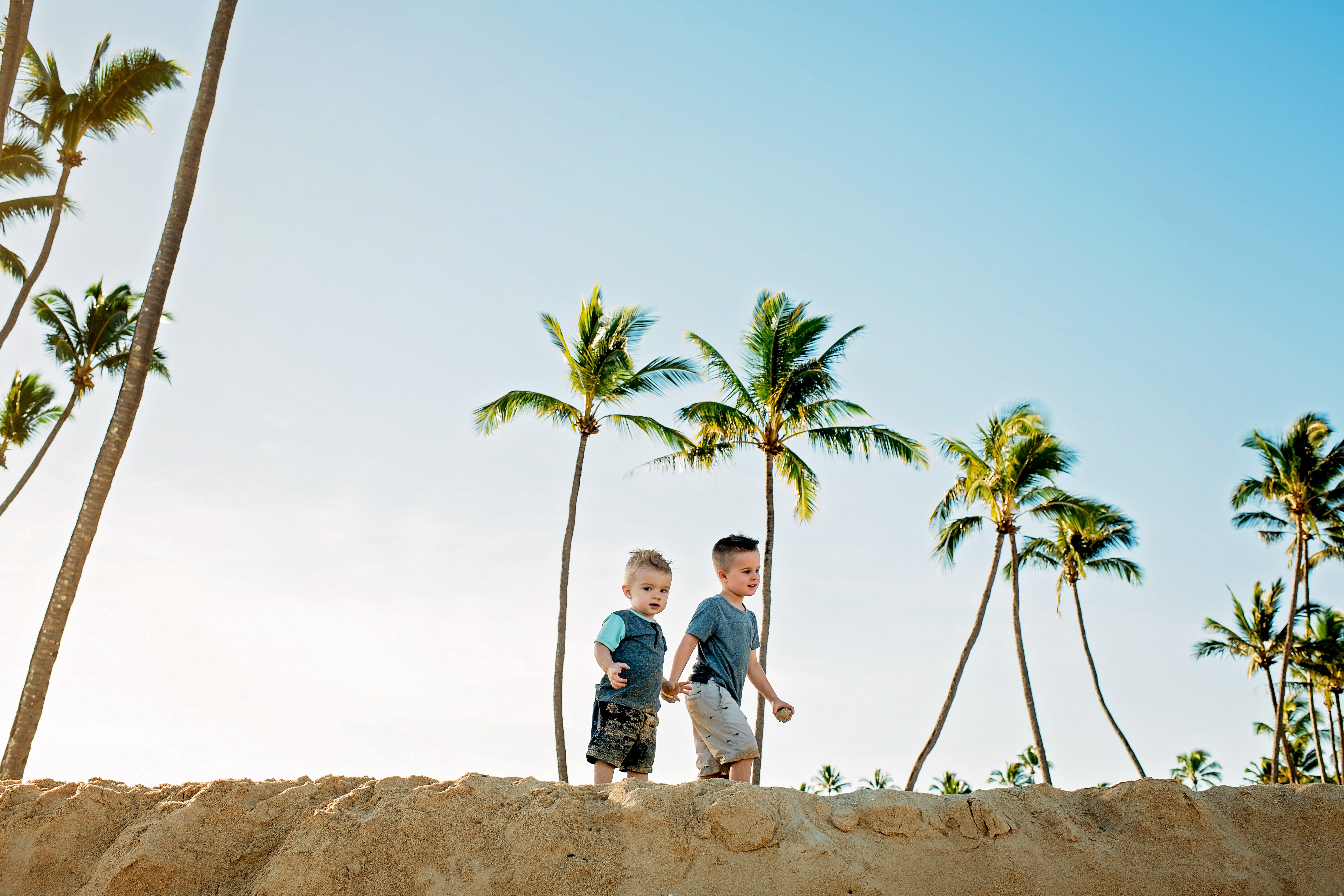 Brothers and palm trees at Baldwin Beach Paia 