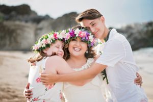 Maui wedding of Art and Suzie on pristine Ironwood Beach featuring a magnificent rainbow photographed by Mariah Milan photographers