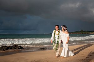 Maui wedding of Art and Suzie on pristine Ironwood Beach featuring a magnificent rainbow photographed by Mariah Milan photographers