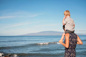 toddler on shoulders on Maui