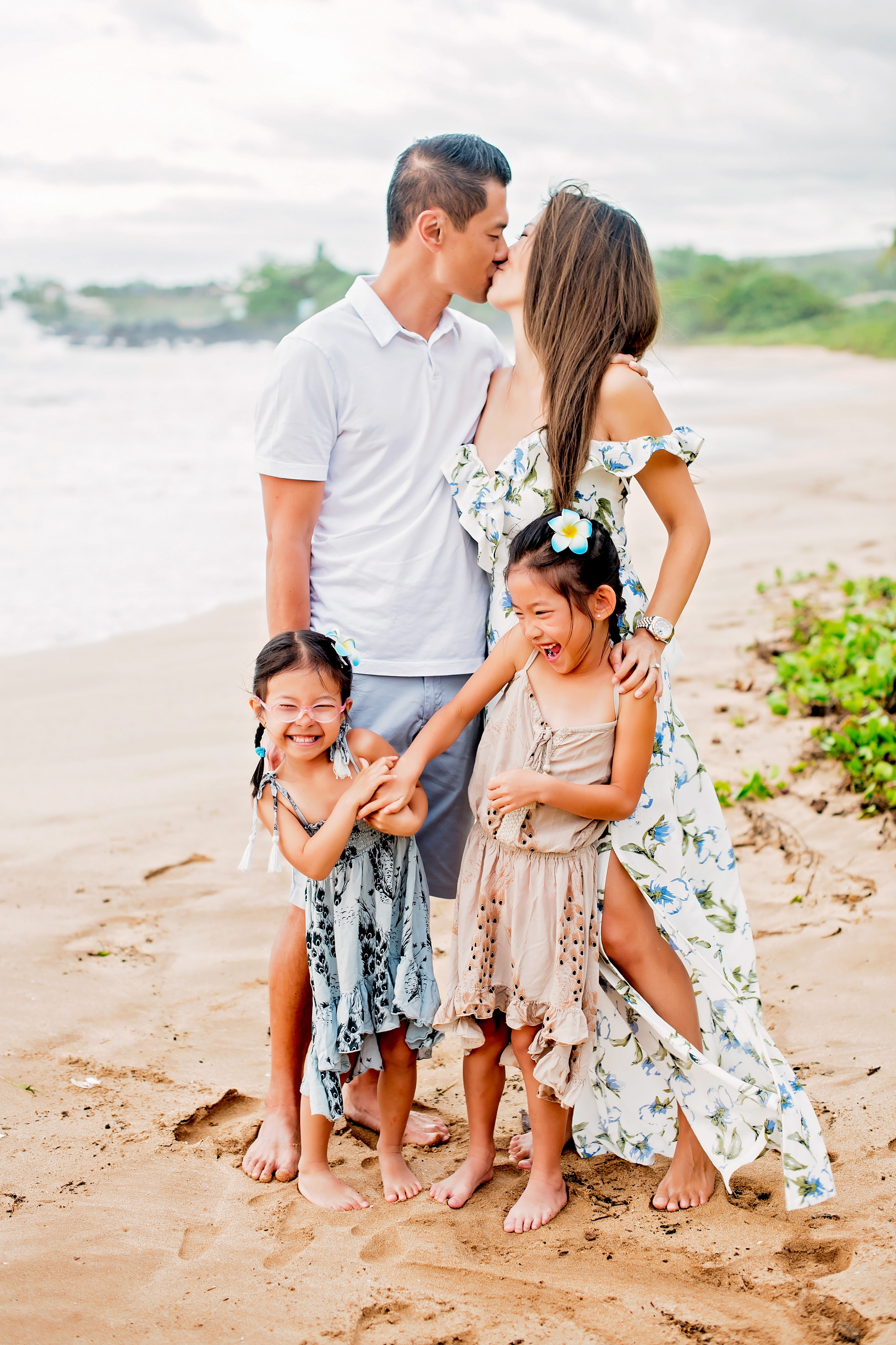 Sunset family session at Maluaka Beach in Makena, Maui on a high tide, stormy evening by Maui photographer Mariah Milan