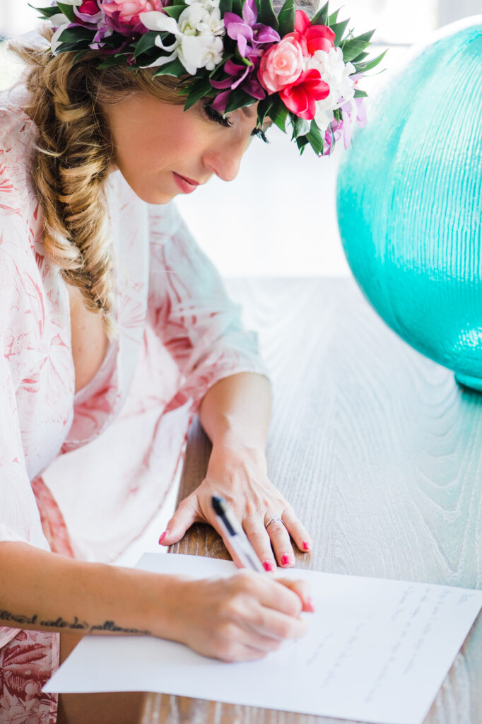 Bride writing her vows, capturing a heartfelt moment before their elopement.