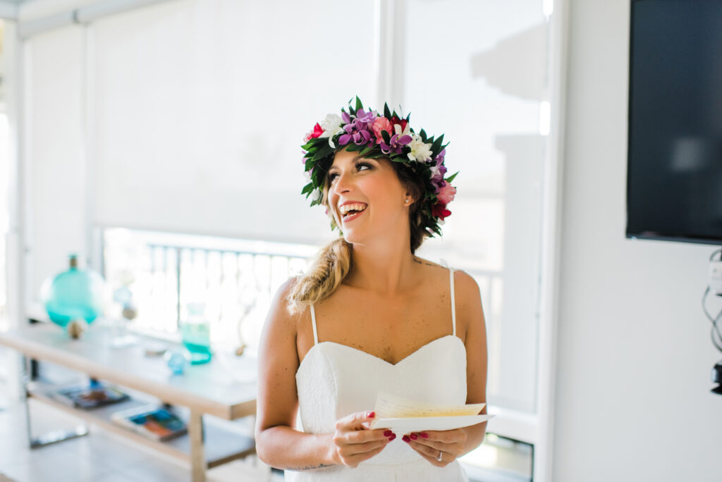 Bride smiling with joy after writing her heartfelt vows for the intimate elopement ceremony.