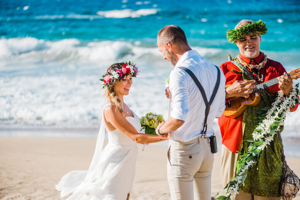 Bride gently holds the groom's face during their elopement, sharing a heartfelt and intimate moment.