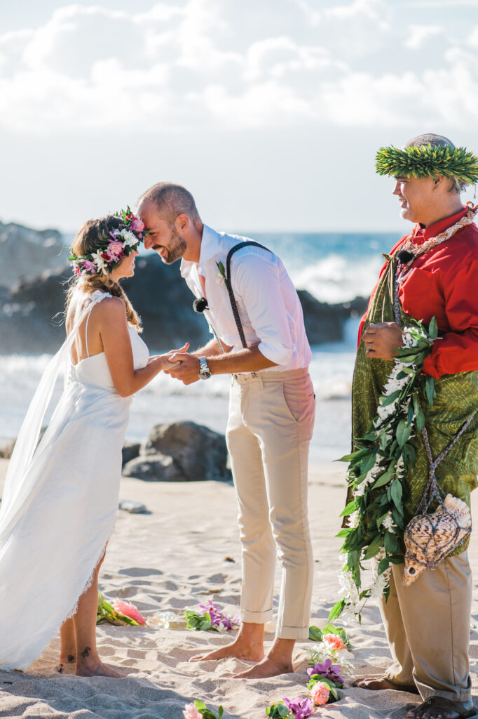 Bride and groom lean in close, sharing a heartfelt moment during their elopement.