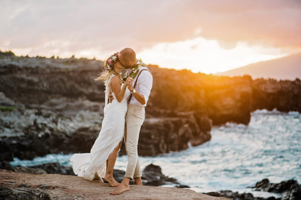 Bride and Groom kisses at sunset, highlighting the romantic essence of their meaningful longer elopement