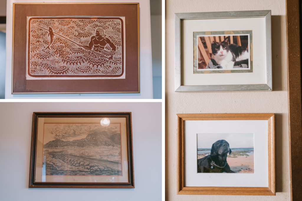 A framed vintage illustration with intricate details hangs on the wall, preserving a piece of the home’s history.