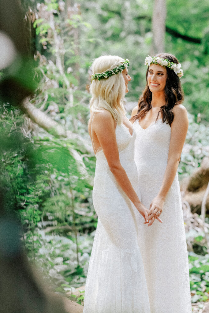 Dori & Natalie exchange loving glances under the forest canopy during their Maui elopement.