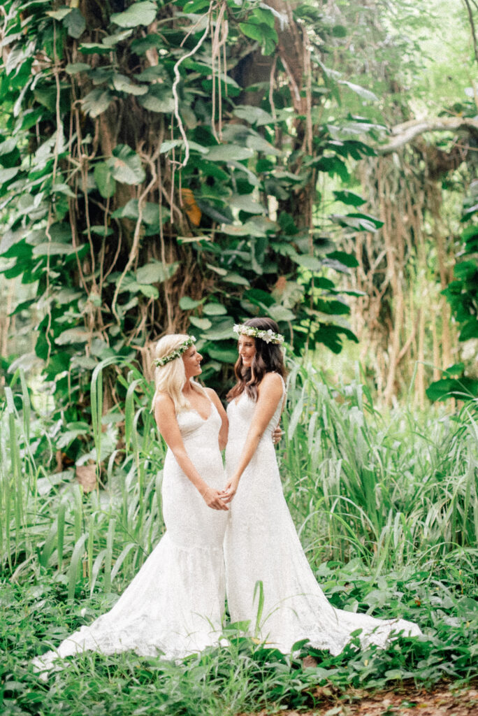 The newlyweds share a loving embrace in the heart of Honolua Forest, Maui.