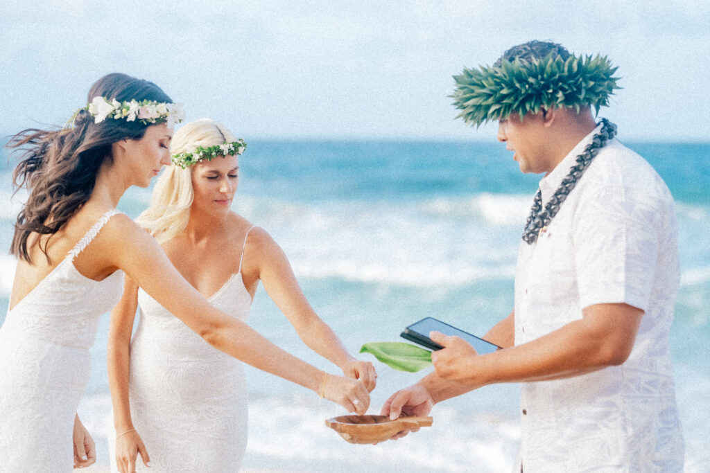 A Hawaiian officiant blesses the couple’s rings, adding tradition to their Maui elopement.