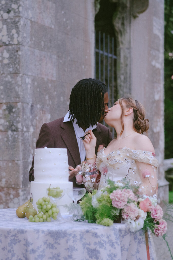 Bride and groom shared a sweet kiss before cutting their cake.