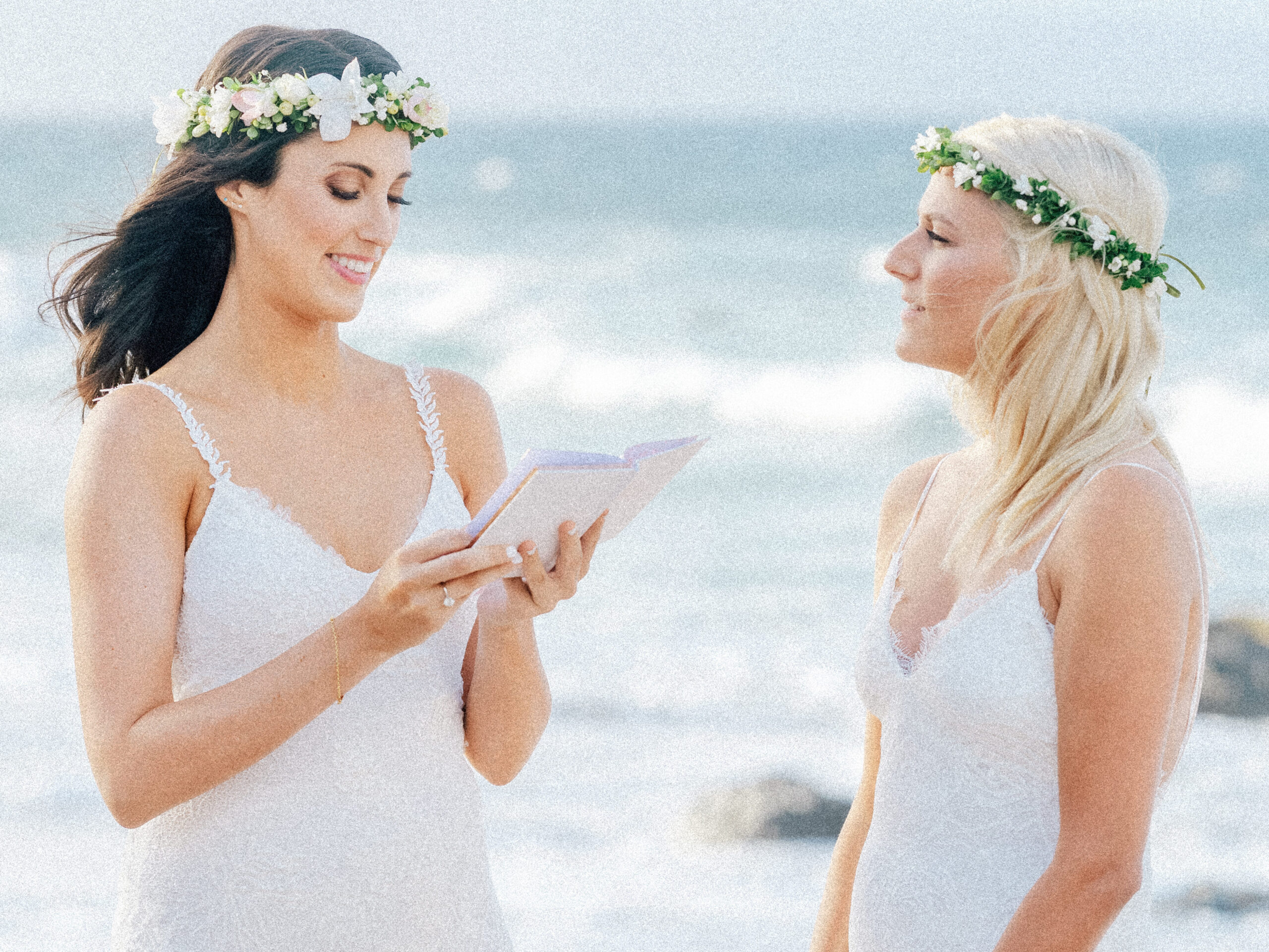 Joyful vows are exchanged on the sand, the brides radiating love in this intimate Maui wedding.
